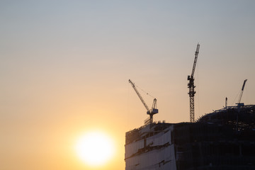 Construction cranes of tall buildings