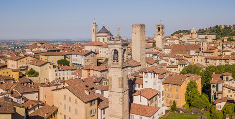 Obraz premium Bergamo, Italy. Amazing drone aerial view of the old town. Landscape at the city center, its historical buildings and the towers