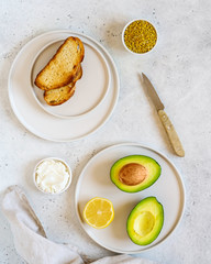 Ingredients for cooking Toast with avocado, ricotta (cream cheese), bee pollen.