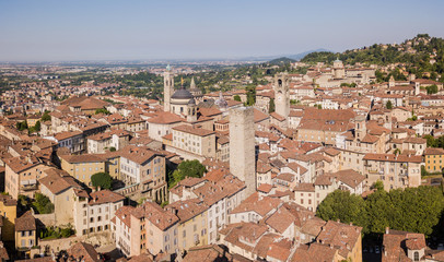 Obraz premium Bergamo, Italy. Amazing drone aerial view of the old town. Landscape at the city center, its historical buildings and the towers