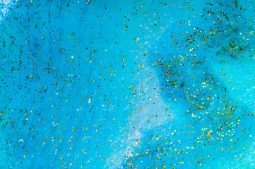 Background transparent slime with golden glitter