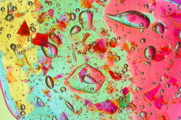 Textured colored background transparent slime with particles inside
