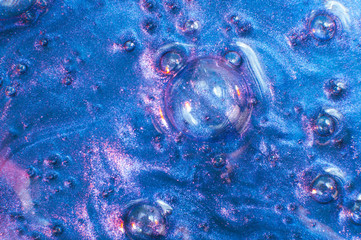 Abstract textured neon gradient blue background slime with bubbles