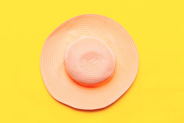 purple summer hat on a yellow background. top view flatlay copyspace