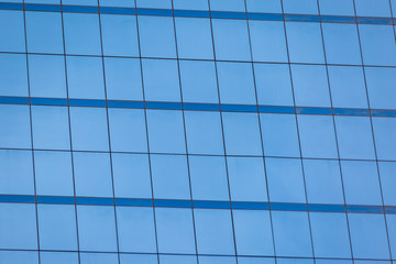 Blue glass windows of office building