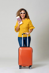 African American woman tourist with luggage