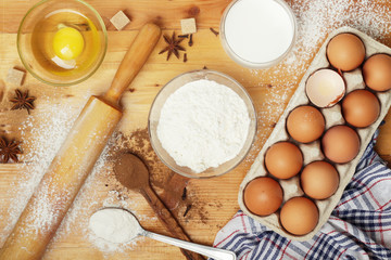 Food ingredients for baking: flour, eggs, milk, sugar	