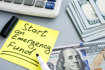 Start an Emergency Fund. Money and calculator.