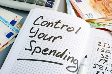 Control your spending. Budgeting book and euros.