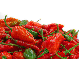 close up heap of fresh red hot chili peppers