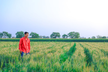 Fototapeta na wymiar Young indian farmer at field