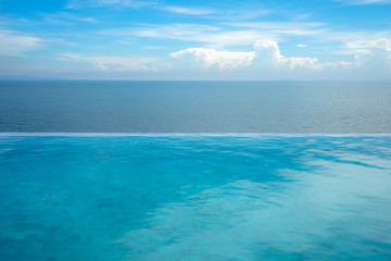 Fototapeta na wymiar Beautiful swimming pool and blue water at the resort with beautiful sea view. Seaside pool