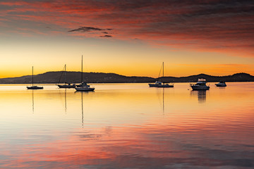 High Clouds, Boats, Reflections and Sunrise on the Bay