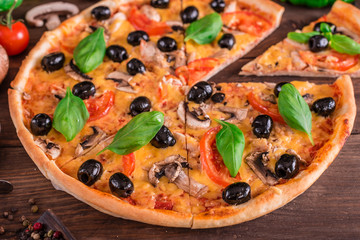 Tasty fresh hot pizza against a dark background. Pizza, food, vegetable, mushrooms