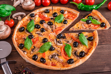 Tasty fresh hot pizza against a dark background. Pizza, food, vegetable, mushrooms