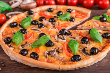 Tasty fresh hot pizza against a dark background. Pizza, food, vegetable, mushrooms
