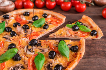 Tasty fresh hot pizza against a dark background. Pizza, food, vegetable, mushrooms