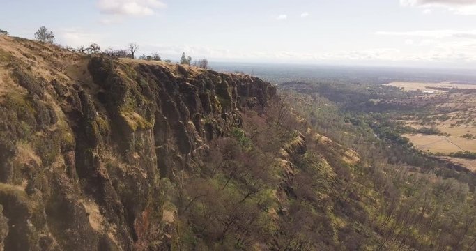 AERIAL: Drone flies adjacent to steep canyon in Chico, California - Butte Country