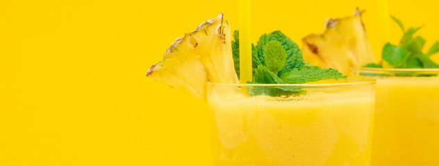 Pineapple smoothie drinks in the glasses