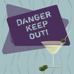 Conceptual hand writing showing Danger Keep Out. Business photo text Warning be alert stay away from this point safety sign Filled Cocktail Wine Glass with Olive on the Rim Text Space