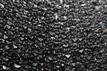 Macro photography of glass with a different pattern. Can be used as background.