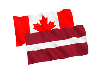 National fabric flags of Canada and Latvia isolated on white background. 3d rendering illustration. 1 to 2 proportion.