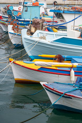 Fototapeta na wymiar Boats in small Aegean sea port in Greece.