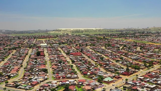 Aerial view over Soweto township homes outside of Johannesburg in South Africa, showcasing the poverty in the ghetto or slums.