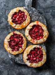 Strawberry pie on a wooden rustic board on a dark background