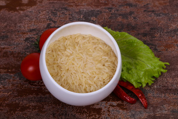 Raw uncooked rice in the bowl
