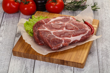 Raw pork neck steak