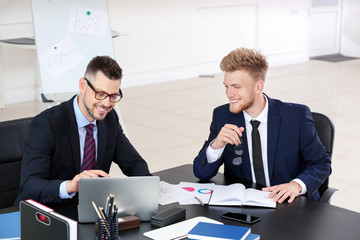 Business partners discussing project in office
