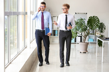 Business partners near window in office