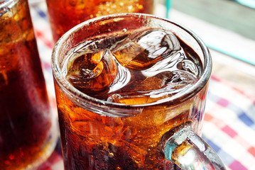 Close up a glass of cola with ice.