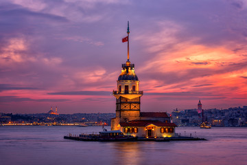 Fiery sunset over Bosphorus with famous Maiden's Tower (Kiz Kulesi) also known as Leander's Tower,...