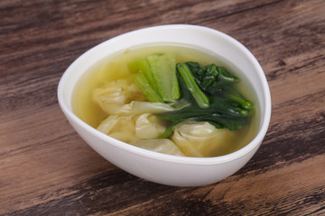 Asian traditional Wonton soup with herbs