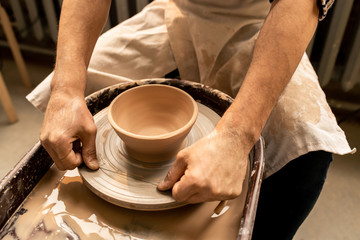 Clay bowl on wheel