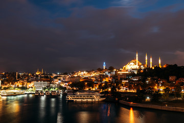 Fototapeta na wymiar Night city Istanbul. Istanbul night landscape. Night view of the city. Galata Tower, Galata Bridge, Karakoy district and Golden Horn at night.