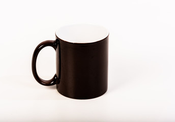 Black left-handed coffee mug on white background.