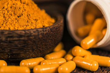 Curcumin Herbal Supplement Capsules and Turmeric Powder