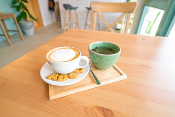 Hot coffee on wooden table