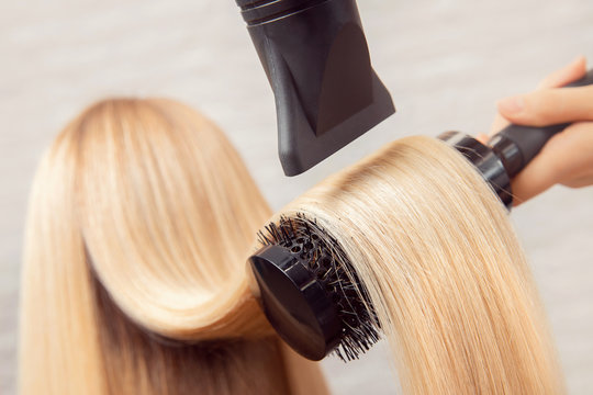 Close-up of hair dryer, concept cut salon, female stylist