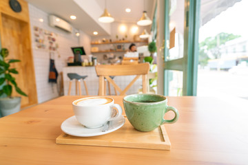 Hot coffee on wooden table