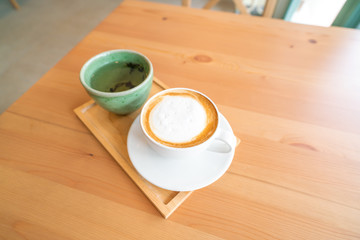 Fototapeta na wymiar Hot coffee on wooden table