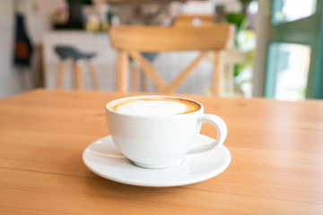 Hot coffee on wooden table