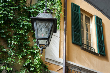 old lamp in front of a house