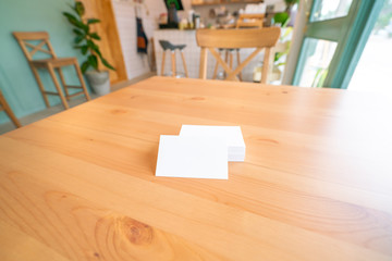 Blank business cards on wooden surface
