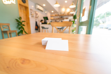 Blank business cards on wooden surface