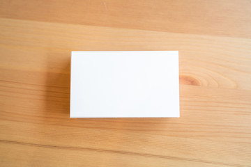 Blank business cards on wooden surface