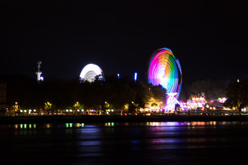 Colourful amusement park night reflection